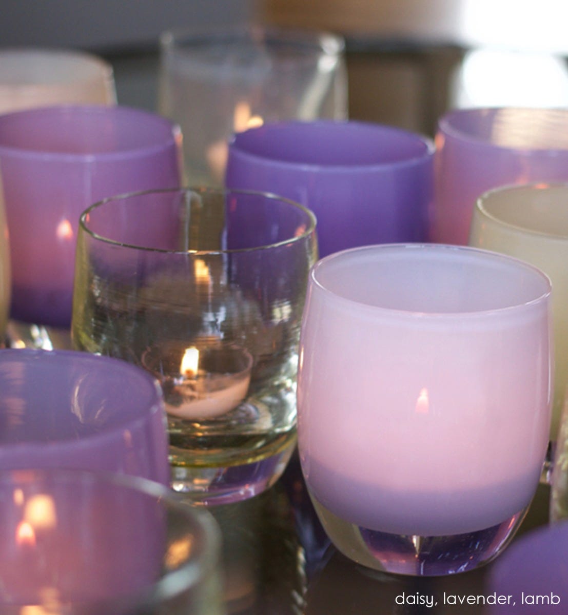 lavender hand-blown glass votive candle holder. Paired with daisy and lamb.