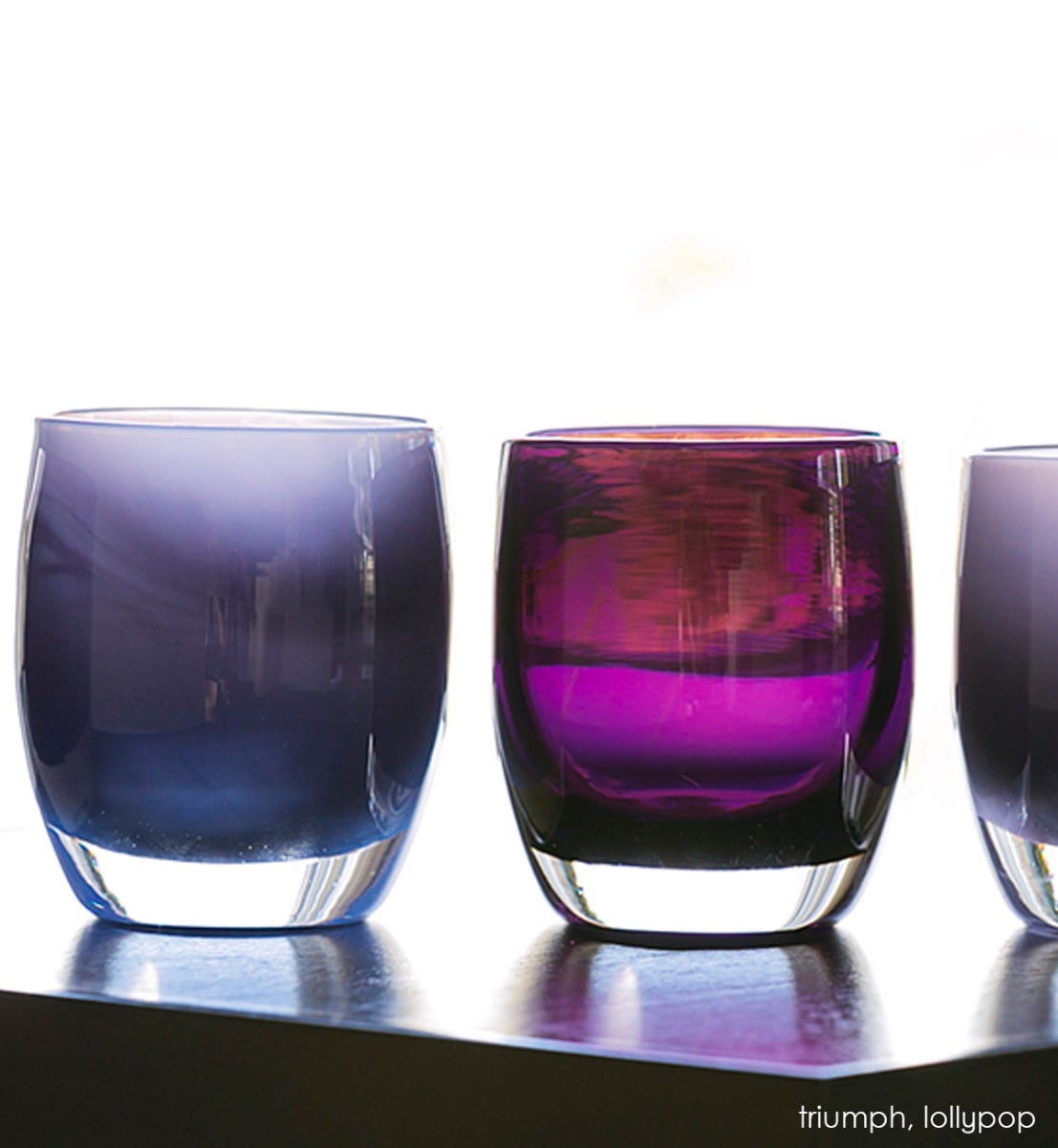 lollypop transparent dark purple hand-blown glass votive candle holder. Paired with triumph.