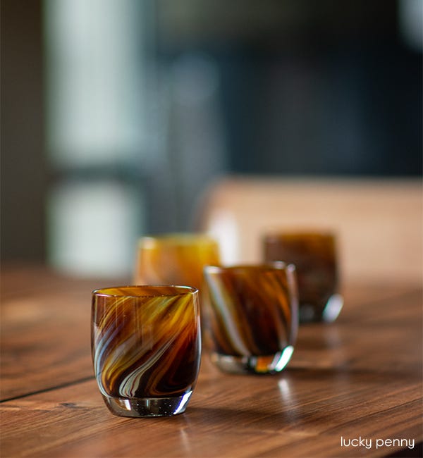 lucky penny brown swirled hand-blown glass votive candle holder.