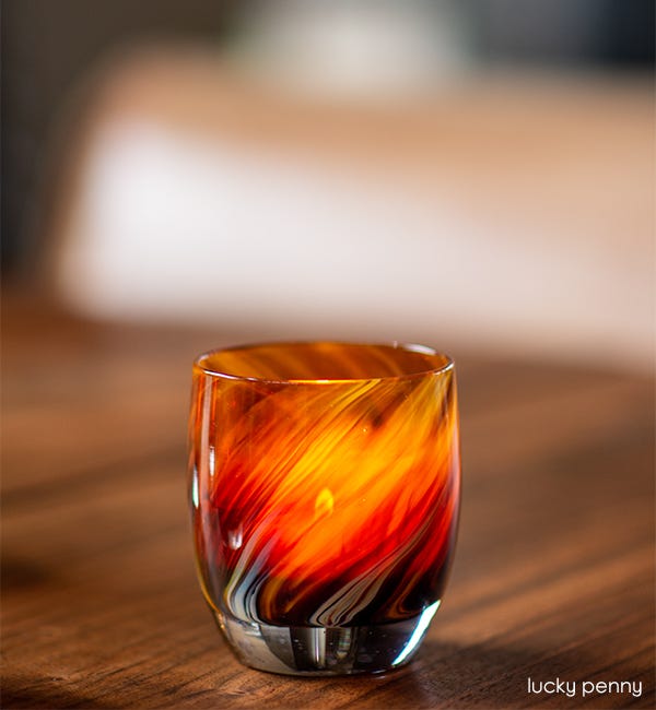 lucky penny brown swirled hand-blown glass votive candle holder.