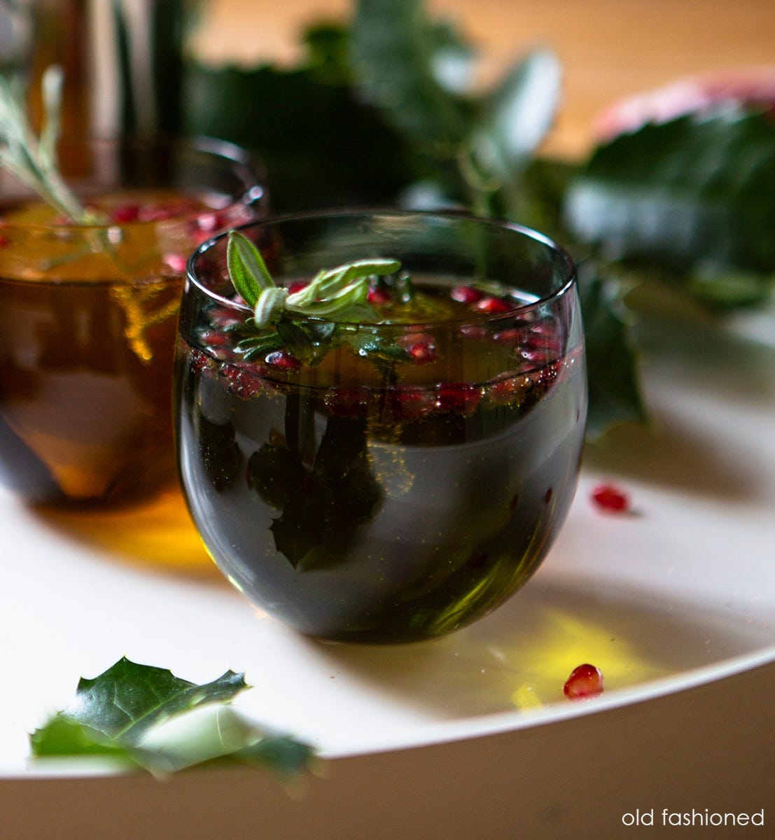 old fashioned drinker, translucent deep green, hand-blown drinking glass.