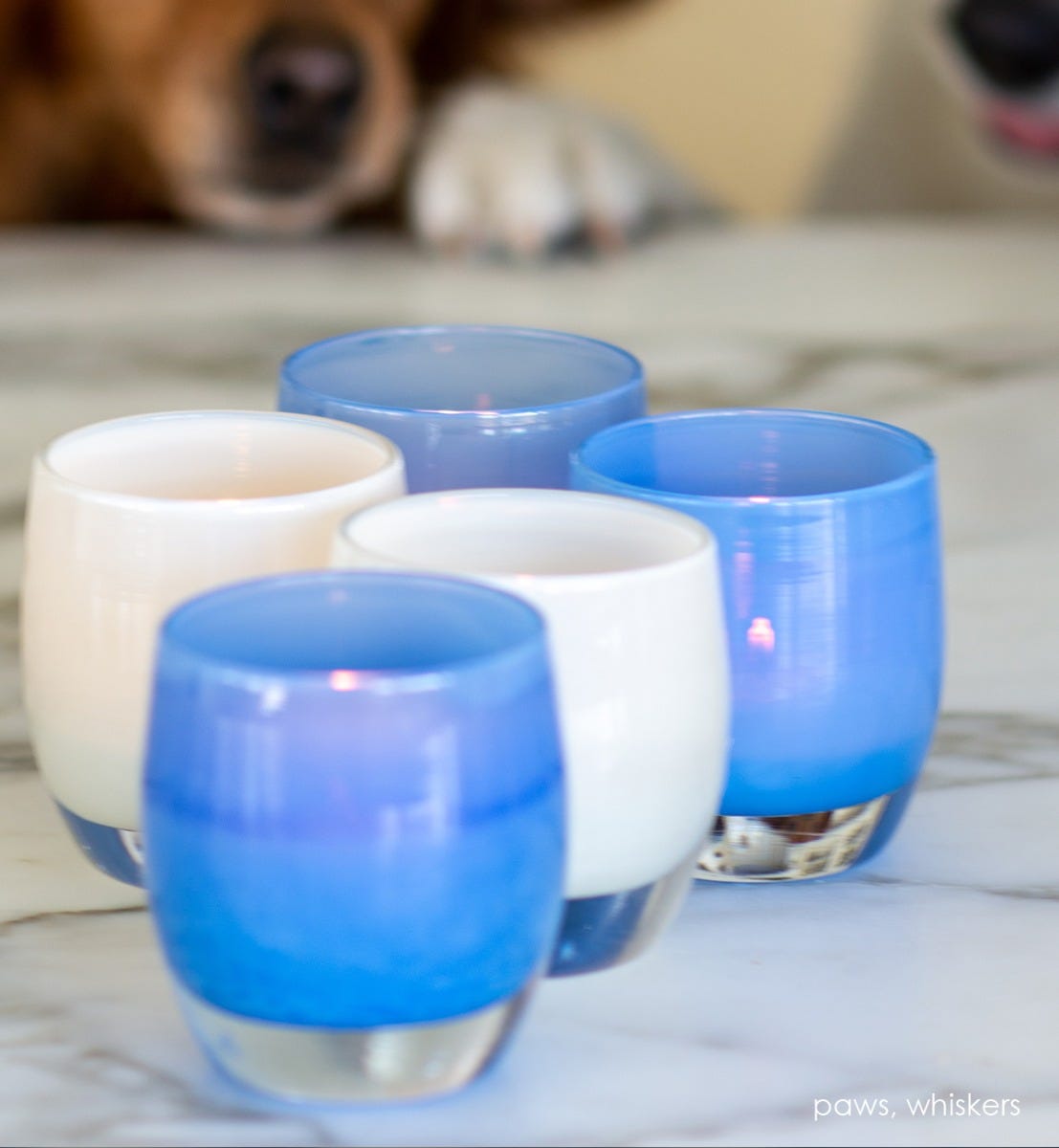 paws, opaque pale blue, hand-blown glass votive candle holder. Paired with whiskers.