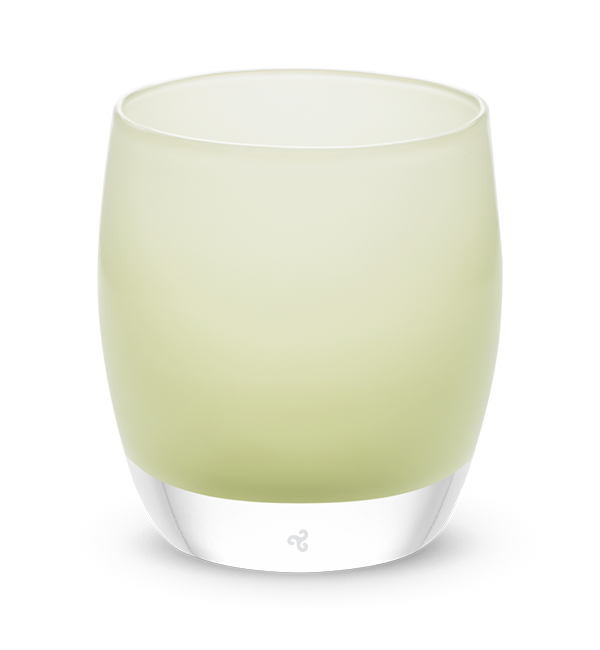 hand-blown off white glass votive candle holder with touch of green.