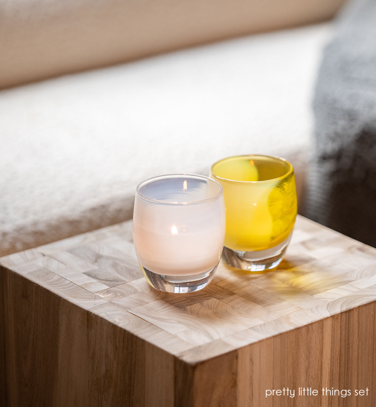 soft white dream and bright yellow just because come together to create a beautiful 2-piece hand-blown candle holder set.