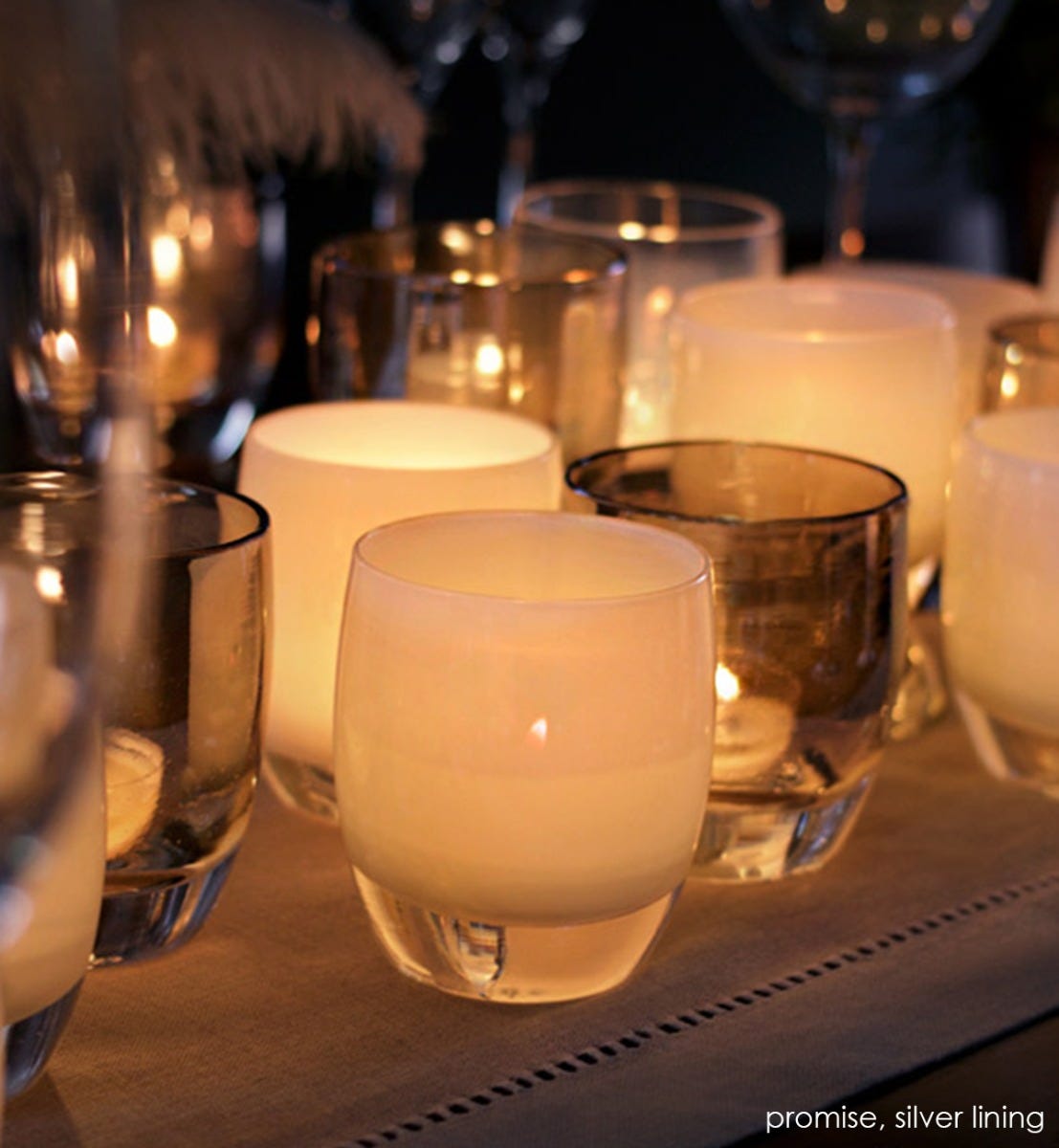 promise cream hand-blown glass votive candle holder. Paired with silver lining.