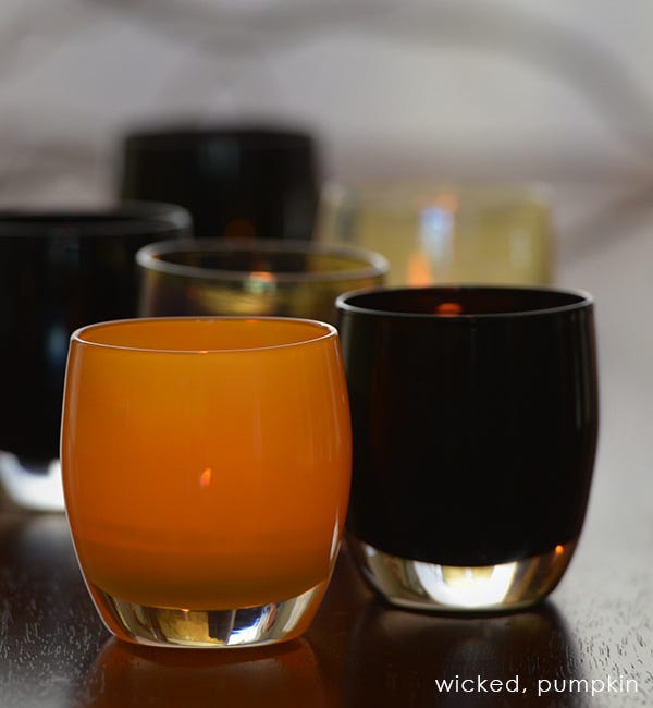 wicked, opaque purple black, hand-blown glass votive candle holder. Paired with pumpkin.