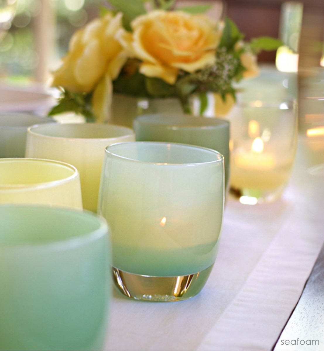 sea foam green hand-blown glass votive candle holder.