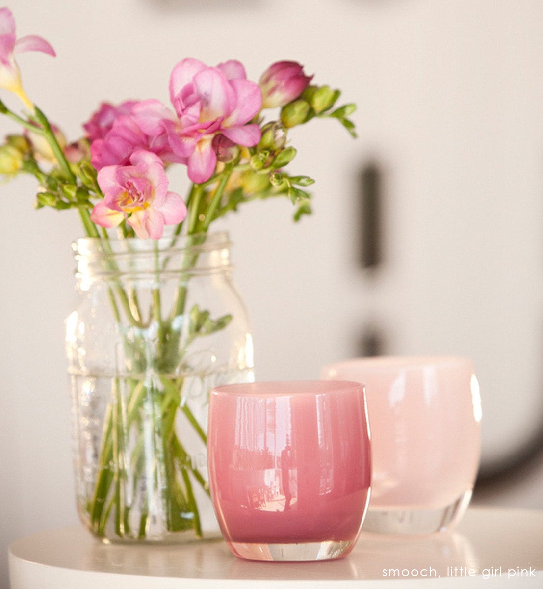 smooch deep pink hand-blown glass votive candle holder. Paired with little girl pink.