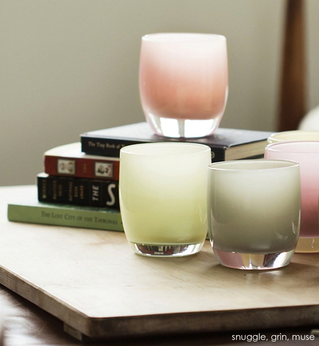 snuggle light peach hand-blown glass votive candle holder. Paired with grin and muse.