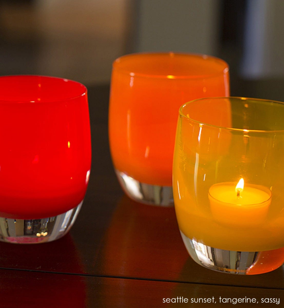tangerine orange hand-blown glass votive candle holder. Paired with seattle sunset and sassy.