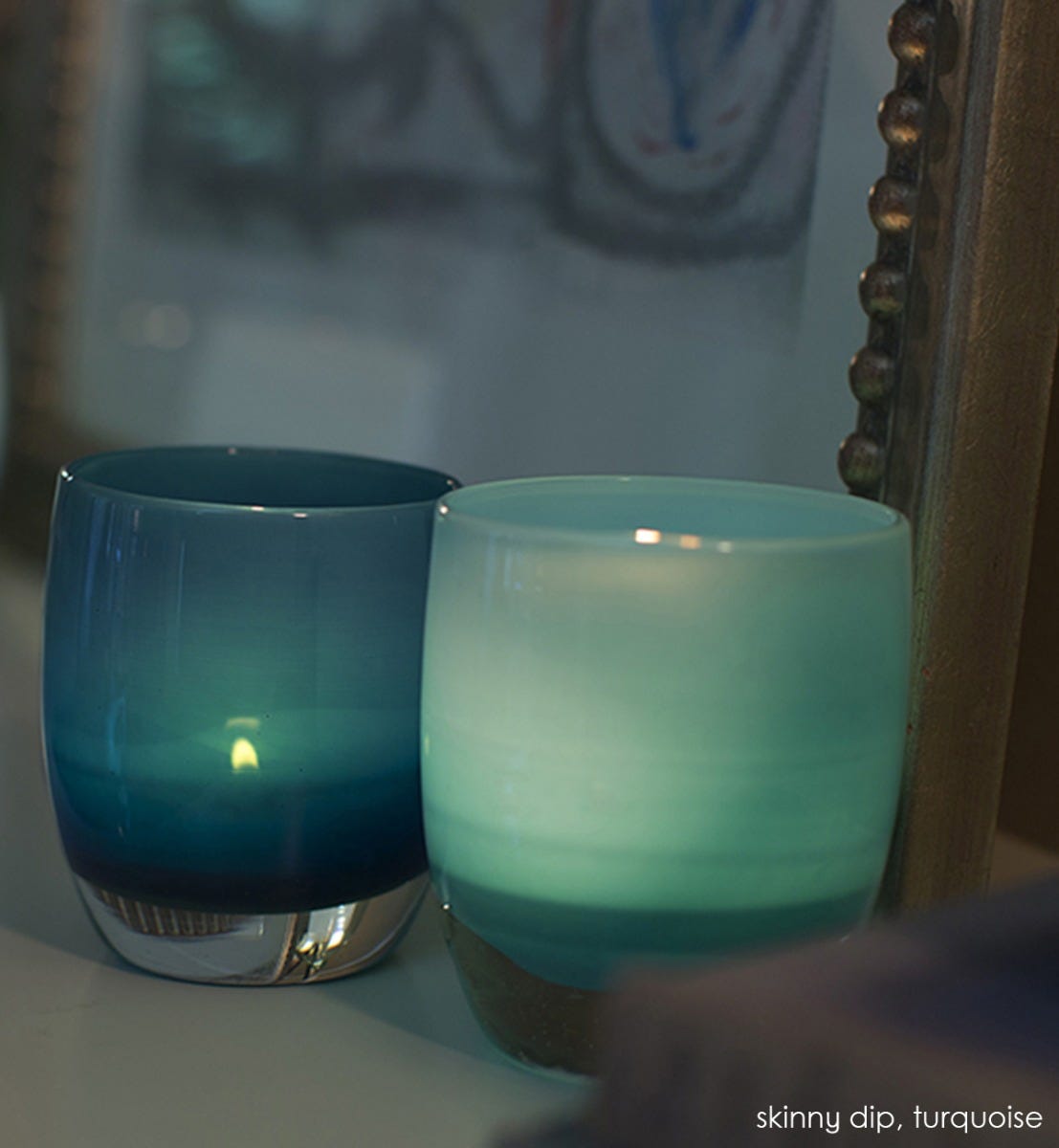 turquoise hand-blown glass votive candle holder. Paired with skinny dip.