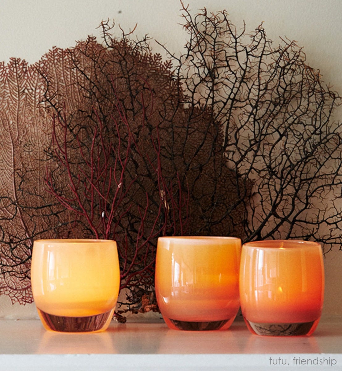 tutu, tan hand-blown glass votive candle holder. Paired with friendship