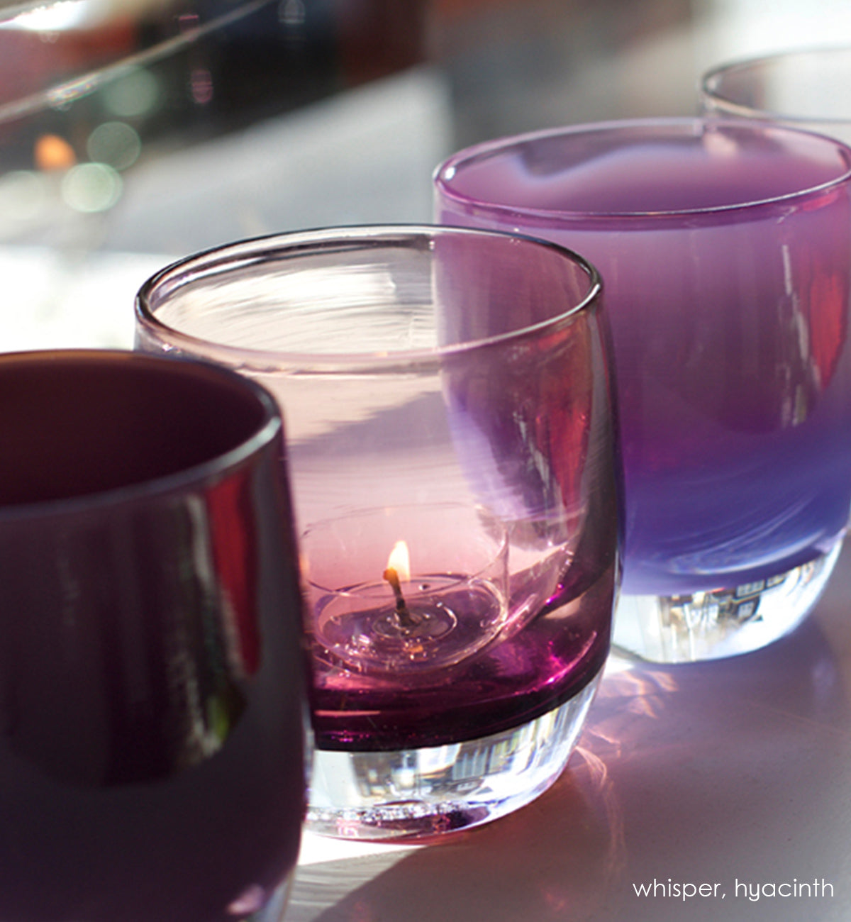 whisper, transparent dusty purple, hand-blown glass votive candle holder, paired with hyacinth
