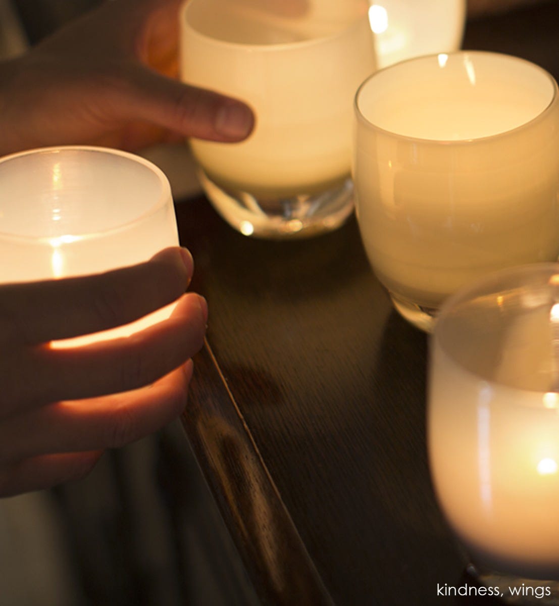 wings, tan grey, hand-blown glass votive candle holder. Paired with kindness.