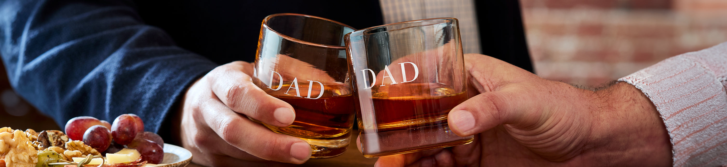 Father and son cheersing rockers engraved with dad 