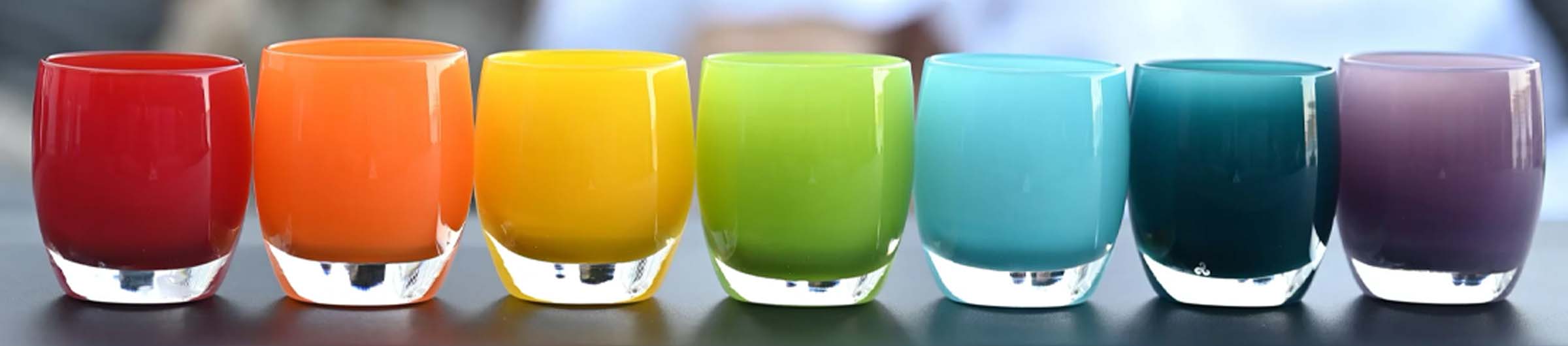 rainbow arrangement of hand-blown glass votive candle holders