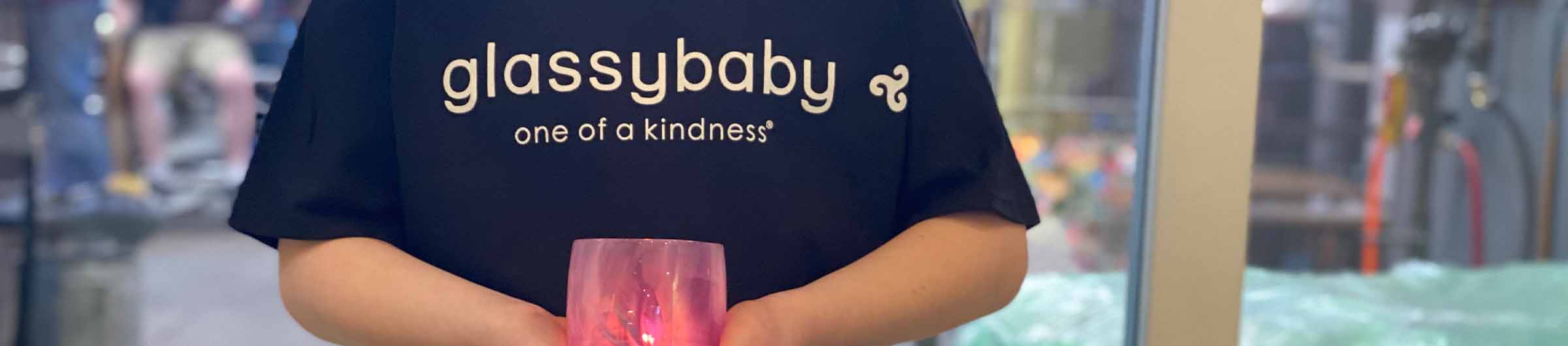 one of a kindness on a black t-shirt, paired with in real life hand-blown glass votive candle holder.