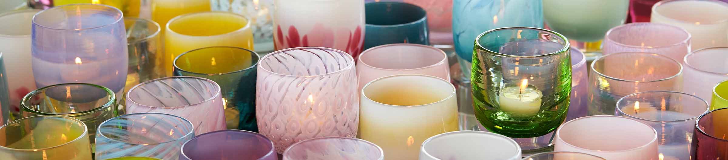 a wide array of hand-blown glass votive candle holders