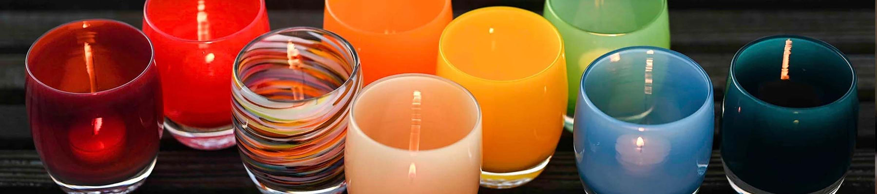 a beautiful collection of hand-blown glass candle holders, perfect for any summer day.