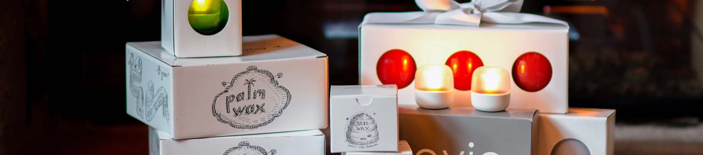 packaged candles and hand-blown glass votive candle holders