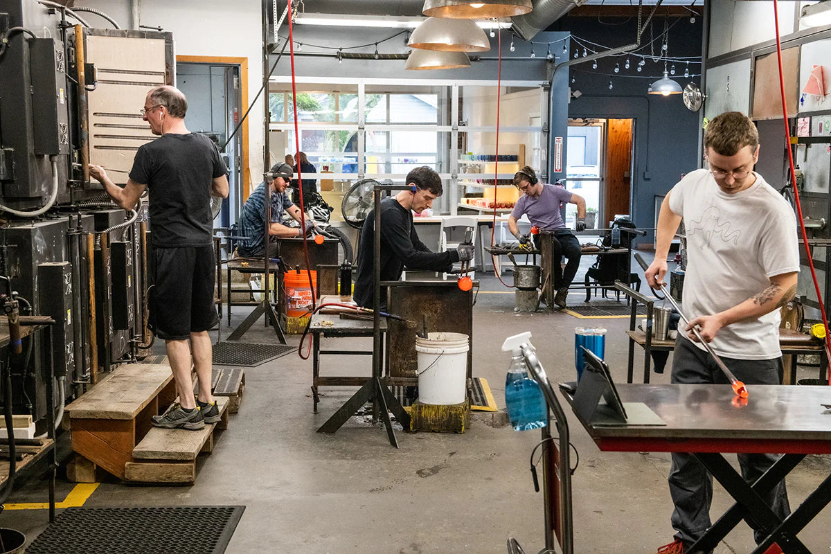 glassblowers making hand-blown glass votive candle holders at Madrona hotshop