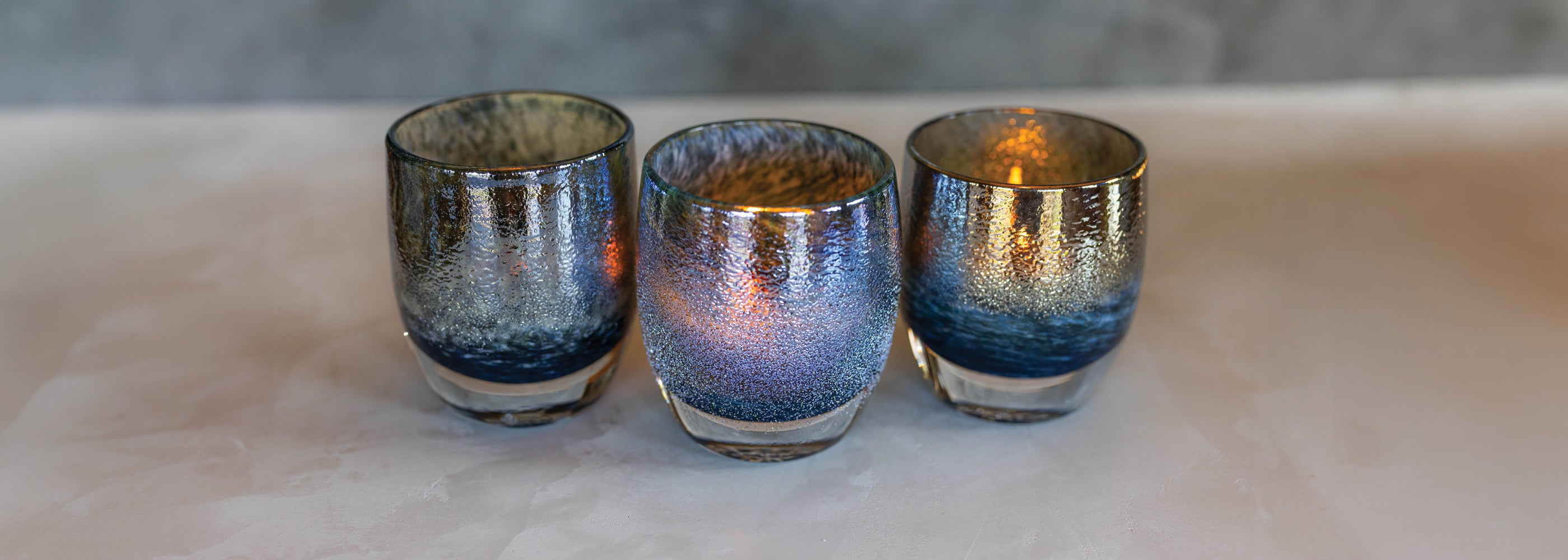 3 Seahawks '50', navy and metallic, hand-blown glass votive candle holders