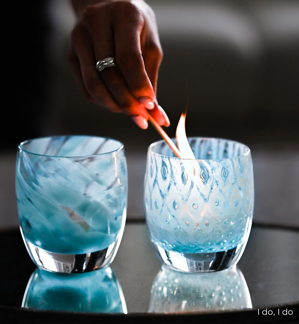 I do, I do is a set of two patterned light blue hand-blown glass candle holders. it includes good choice, a light blue bubble pattern and blessing a mottled blue pattern.