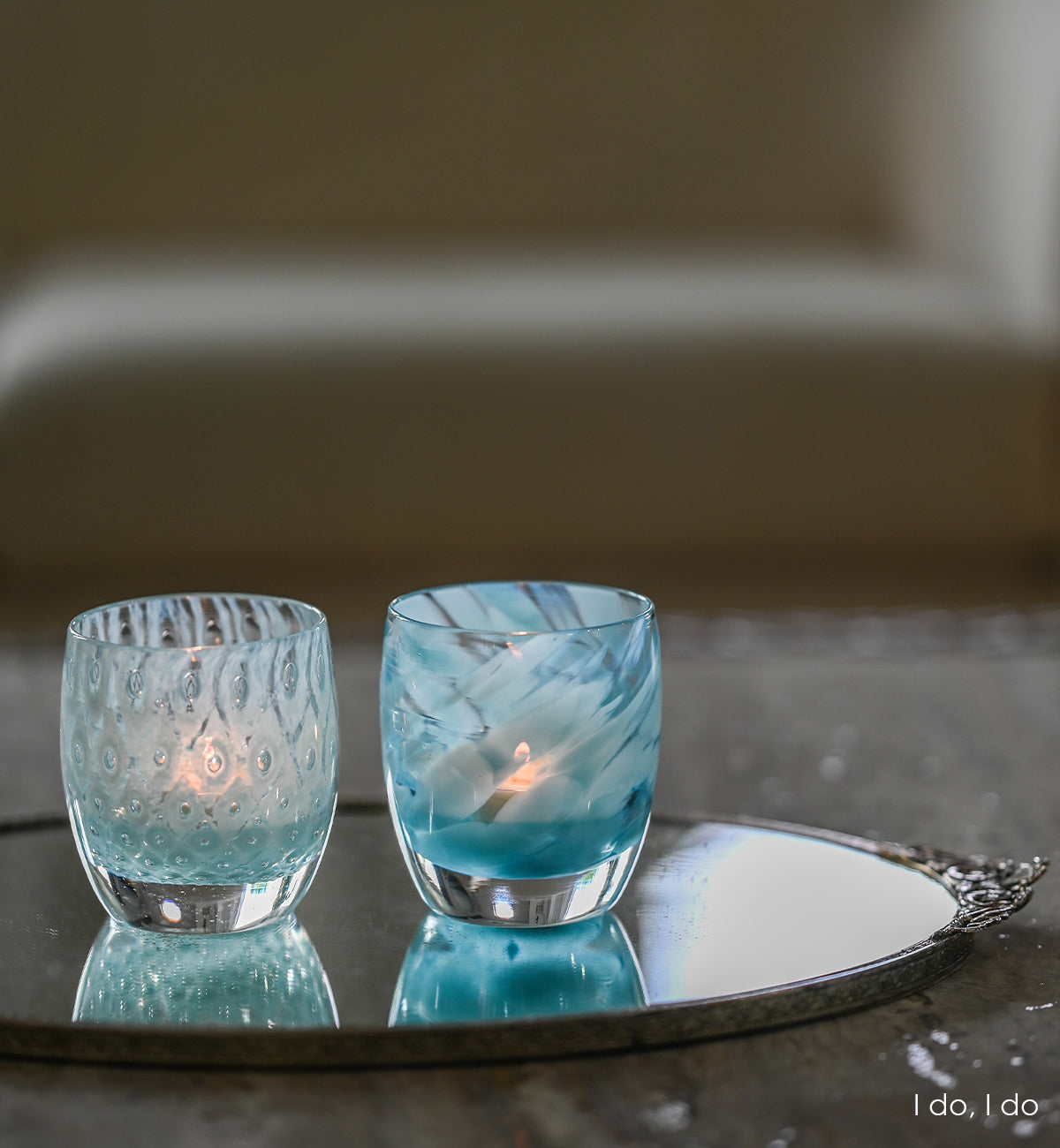 I do, I do is a set of two patterned light blue hand-blown glass candle holders. it includes good choice, a light blue bubble pattern and blessing a mottled blue pattern.