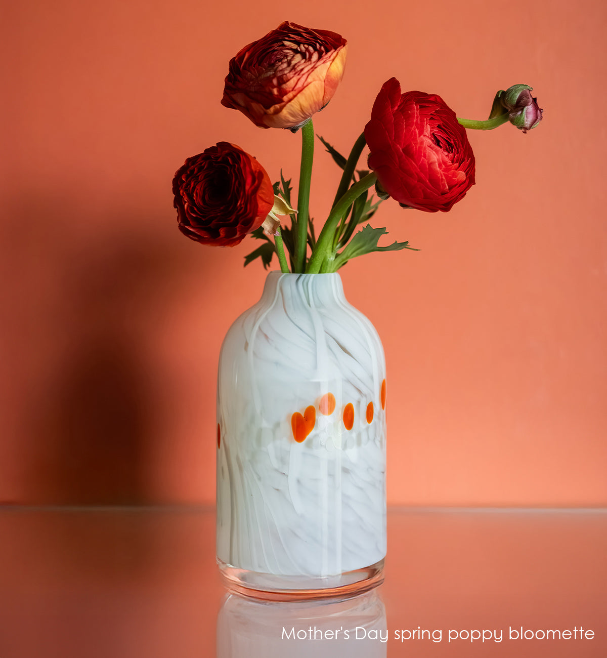 white marble bloomette vase with red spots with red flowers with red background