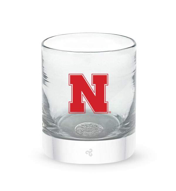 University of Nebraska rocker, clear hand-blown lowball drinking glass with University of Nebraska hand-etched in red.