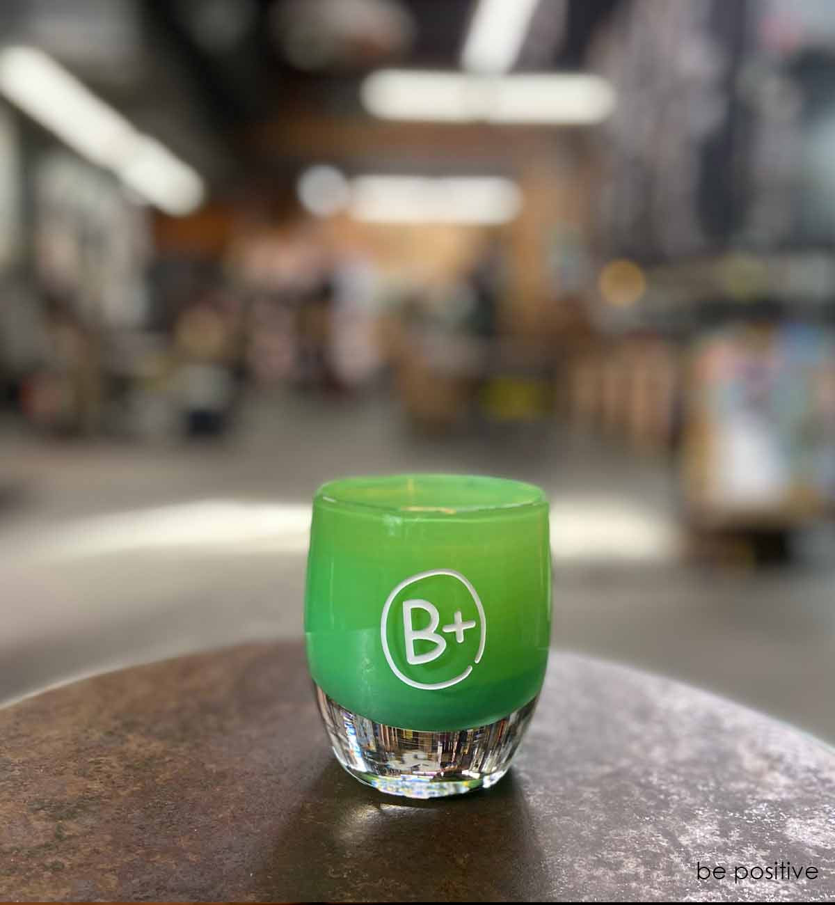be positive on a stool in the hot shop, hand-blown glass votive candle holder.