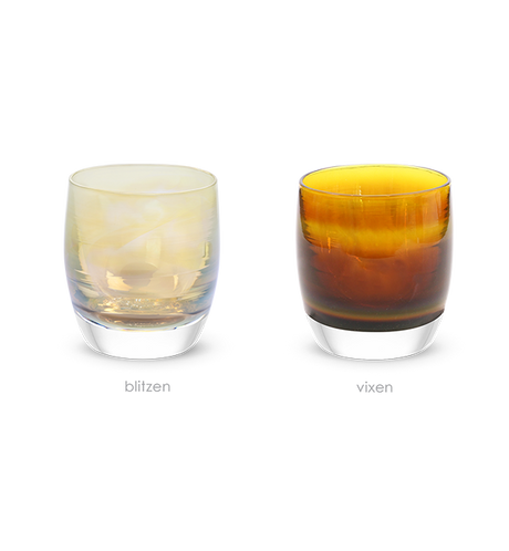 a set of iridescent brown and yellow translucent glassybaby candle holders. 'the reindeer', 'blitzen' and 'vixen' add a warm glow to any holiday occasion. 