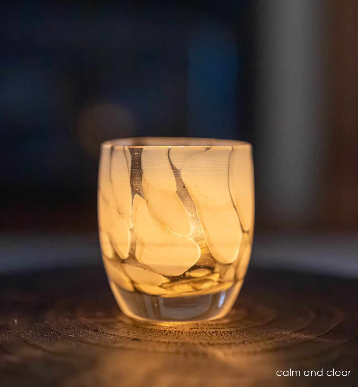 glowing calm and clear gray and white petal, hand-blown glass votive candle holder.