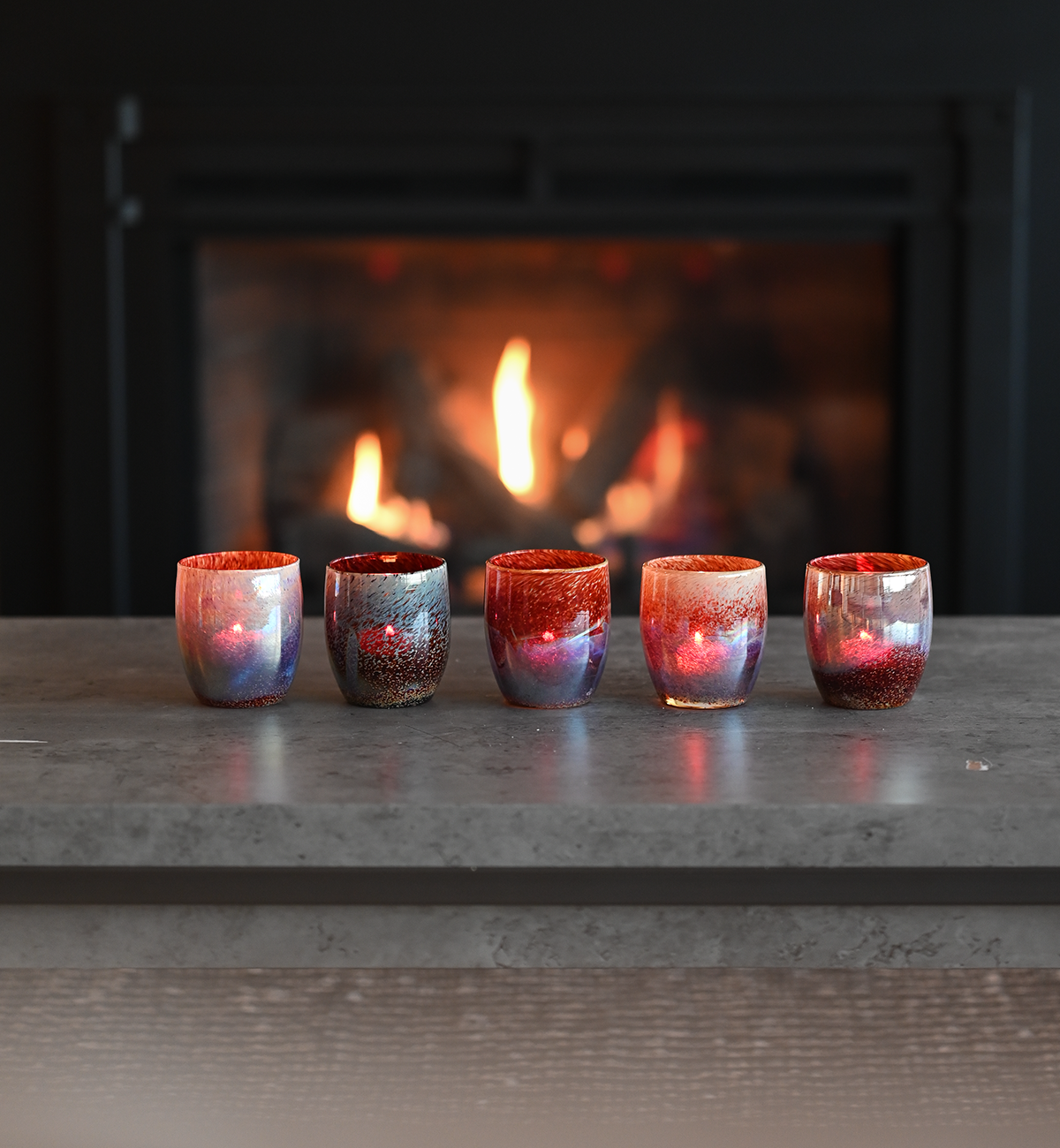 campfire is a textured brown and red hand-blown glass candle holder.