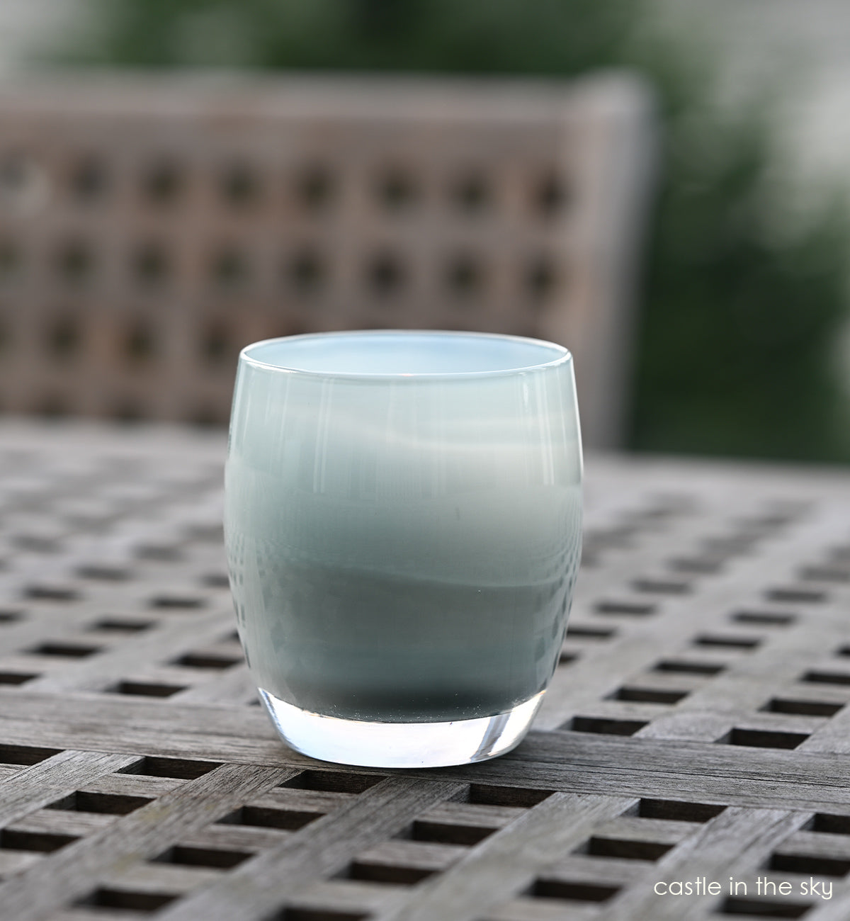 castle in the sky grey hand-blown glass votive candle holder.