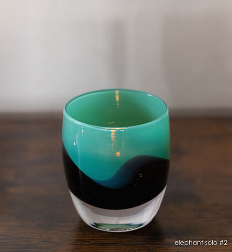 elephant solo #2 green/brown hand-blown glass candle holder. 