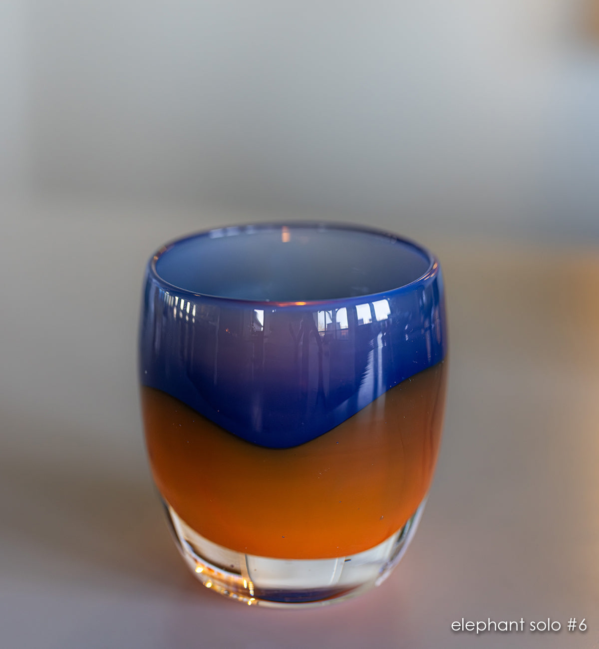 elephant solo #6 navy/orange hand-blown glass candle holder. 