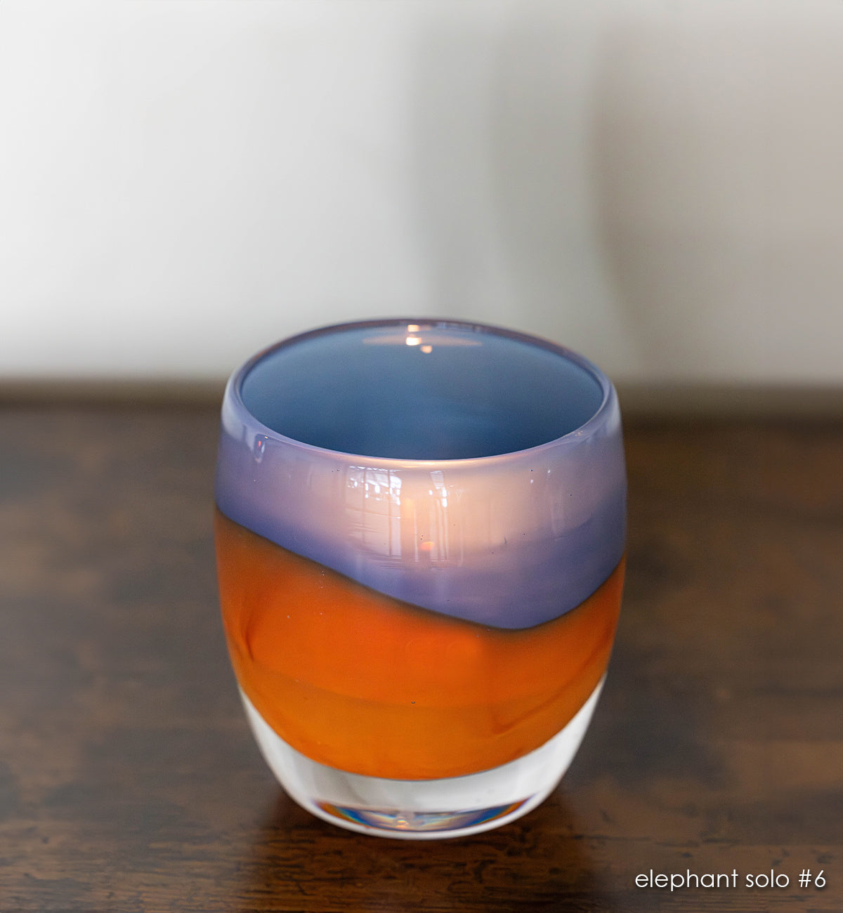 elephant solo #6 navy/orange hand-blown glass candle holder. 