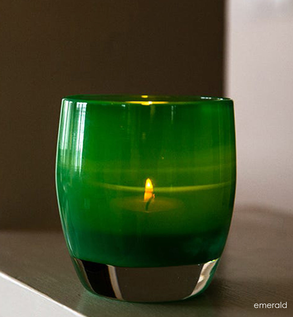 emerald is green a hand-blown glass candle holder.