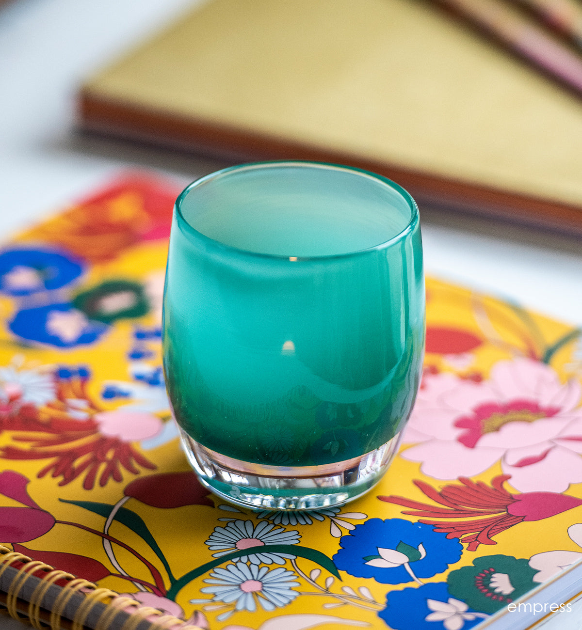 empress is a beautiful elegant green, hand-blown glass votive candle holder.