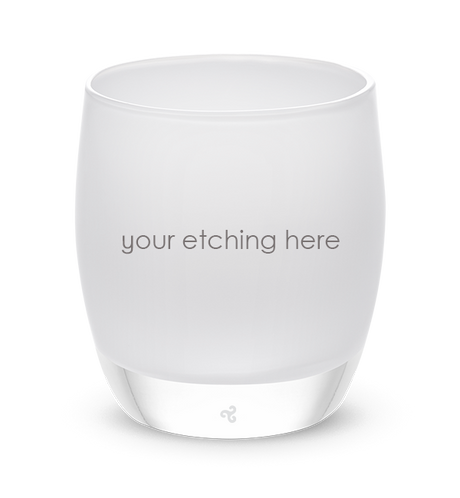 white hand-blown glass votive candle holder displaying "your etching here" across the front