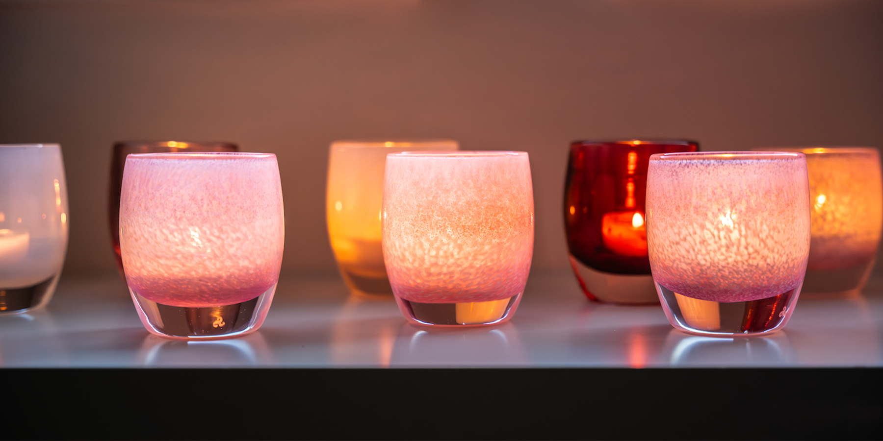 fabulous, shimmering layered pink hand-blown glass votive candle holder.