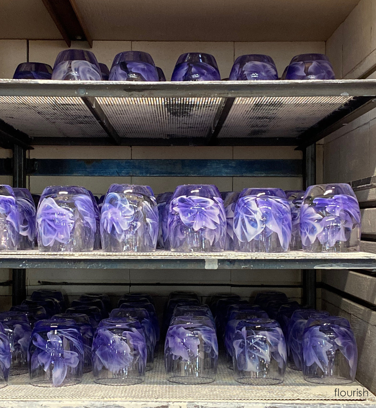 beautiful purple hand-blown glass murrini style candle holders cooling in the annealer