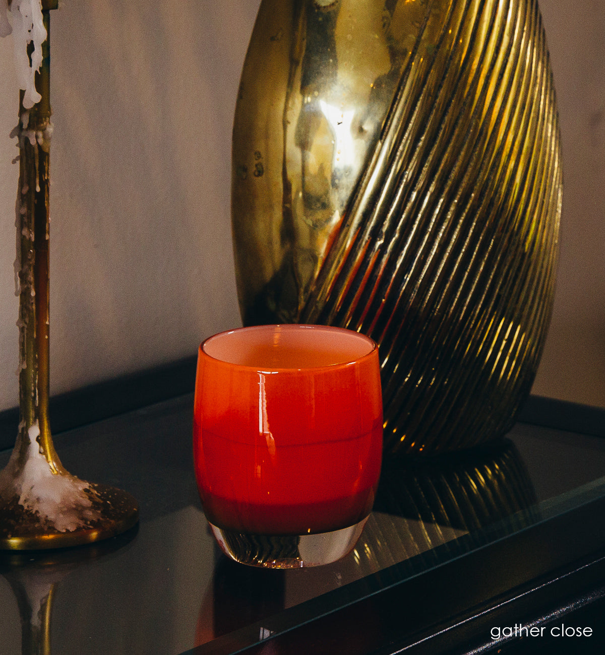 gather close, opaque amber, hand-blown glass votive candle holder.