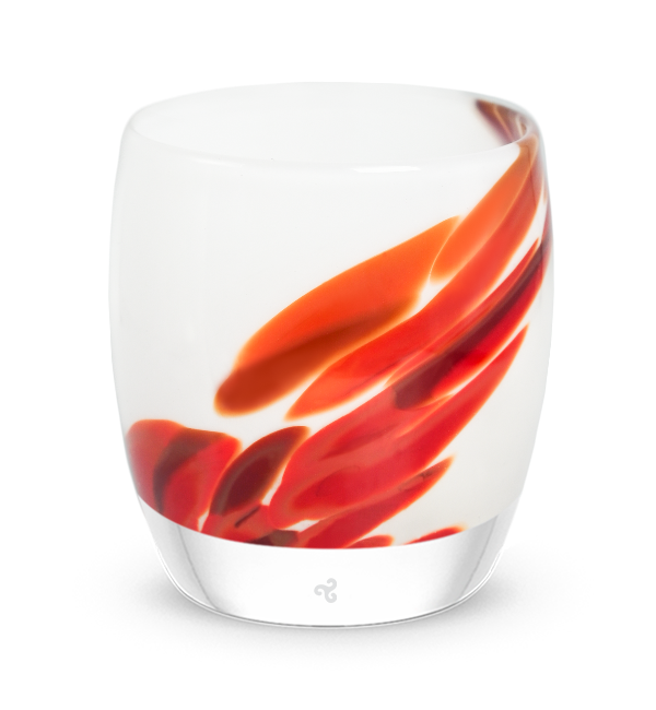 white and red patterned hand-blown glass candle holder. 