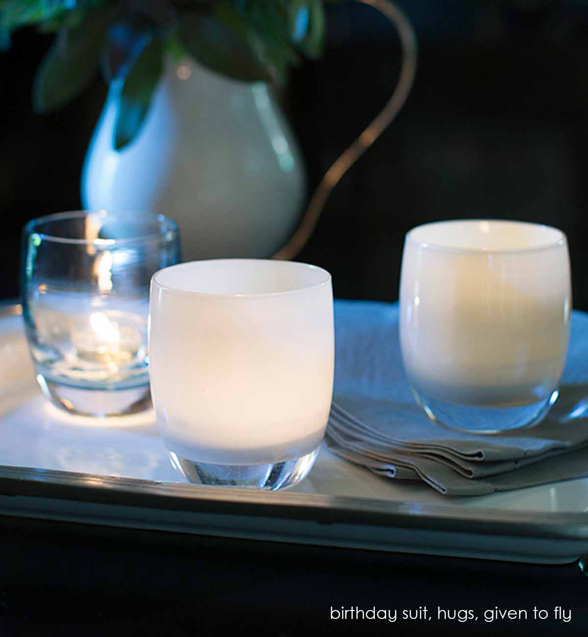 given to fly, sea salt, hand-blown glass votive candle holder. Paired with birthday suit and hugs.