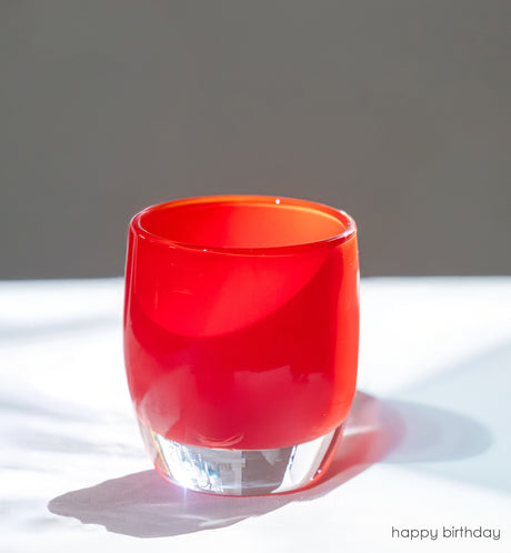 happy birthday bright red, hand-blown glass votive candle holder. 