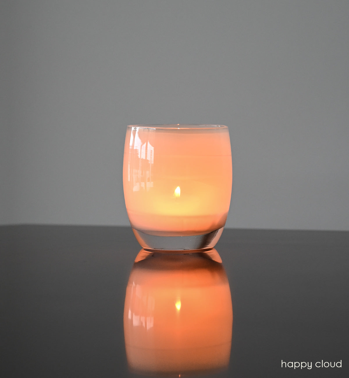 happy cloud light grey hand-blown glass candle holder.