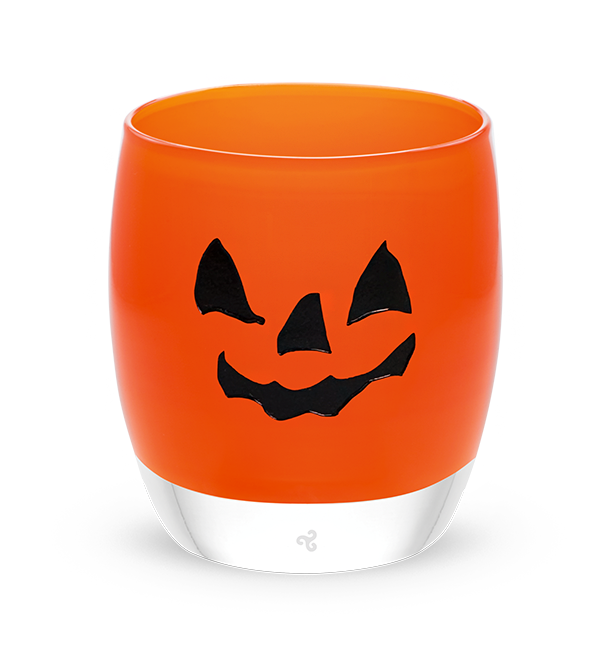 jack-o-lantern, orange hand-blown glass votive candle holder with a spooky jack-o-lantern face hand-etched in black fill.