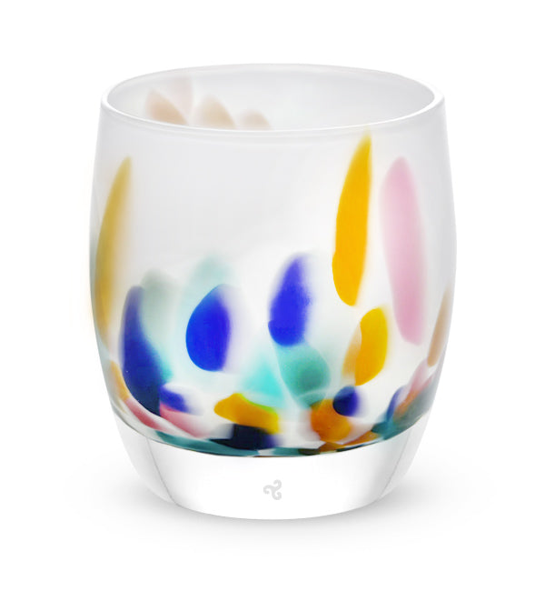 mahalo, white with multi-colored yellow, pink, teal, purple and green petals hand-blown glass votive candle holder.